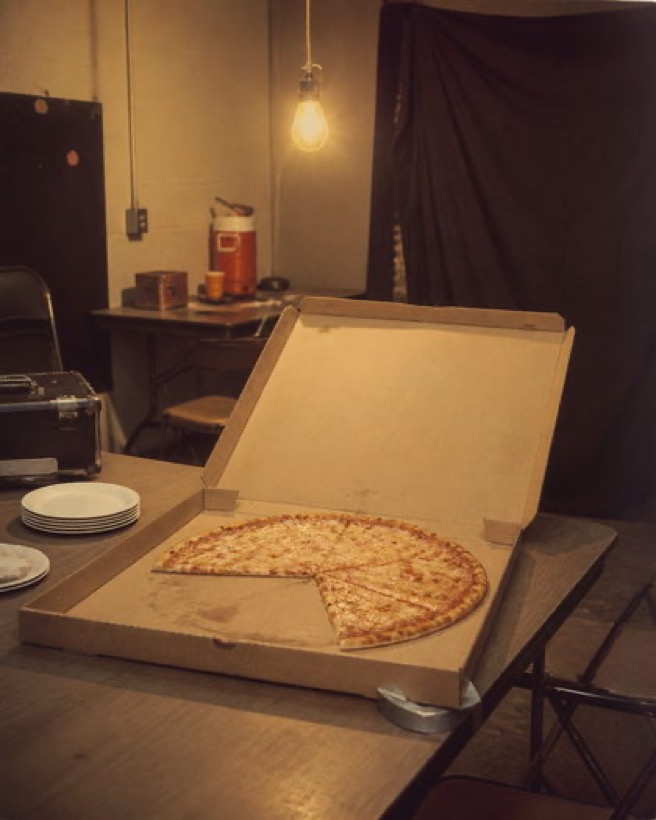 Pizza boxes under a work light