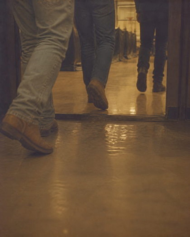 Boots on a gym floor between groups